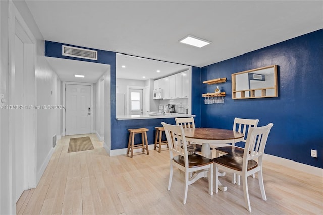 dining room featuring light hardwood / wood-style flooring