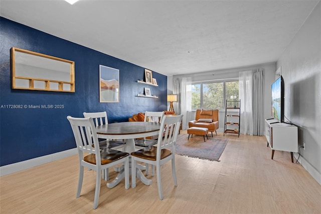 dining room with hardwood / wood-style floors