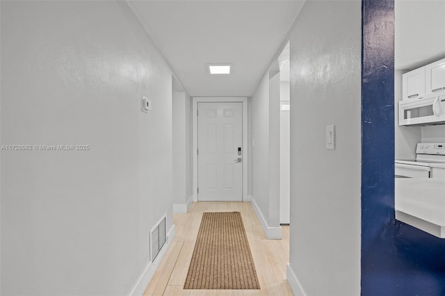 1400 NE 191st St Unit 307, Miami, FL 33179 - hallway with light wood-type flooring and baseboards