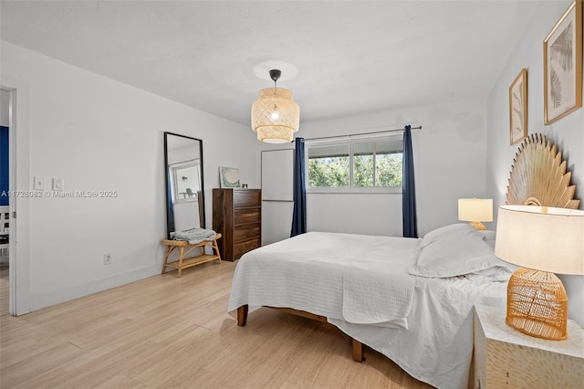 1400 NE 191st St Unit 307, Miami, FL 33179 - bedroom with light wood finished floors and baseboards