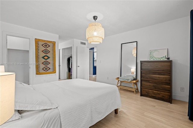 1400 NE 191st St Unit 307, Miami, FL 33179 - bedroom featuring light wood-style floors and baseboards