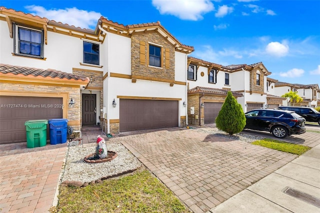 multi unit property featuring a garage