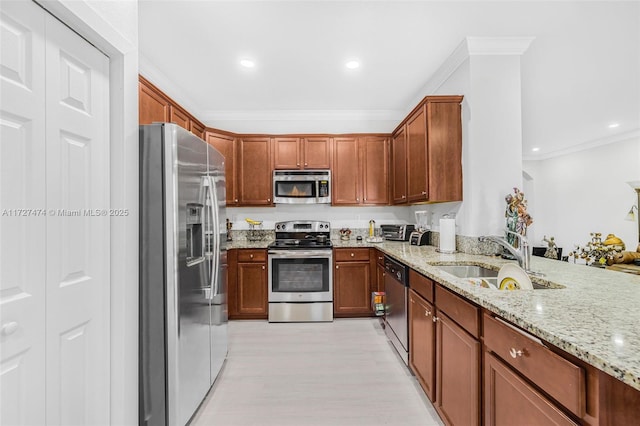 kitchen with kitchen peninsula, stainless steel appliances, light stone countertops, crown molding, and sink