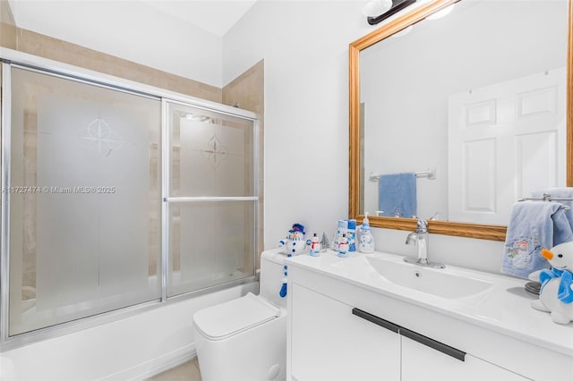 full bathroom with toilet, vanity, and combined bath / shower with glass door