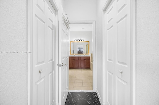 hall with tile patterned flooring