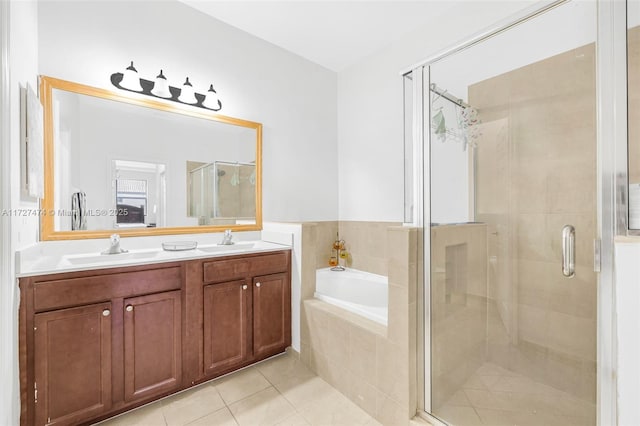 bathroom featuring separate shower and tub, vanity, and tile patterned floors