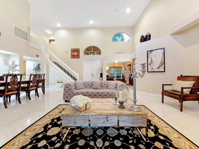 living room with a high ceiling