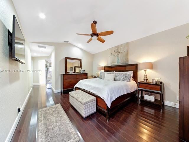 bedroom with dark wood-type flooring, ceiling fan, and lofted ceiling