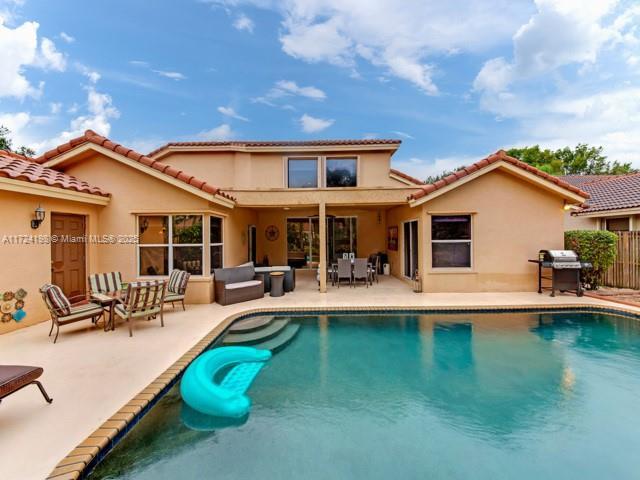 back of house with a patio area