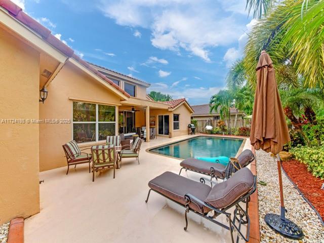 view of pool with an outdoor living space and a patio