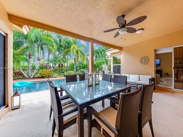 view of patio / terrace with ceiling fan and an outdoor hangout area