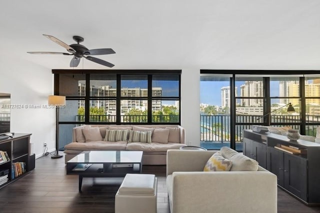 living room featuring ceiling fan, dark hardwood / wood-style floors, a wealth of natural light, and floor to ceiling windows