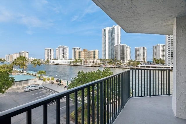 balcony featuring a water view