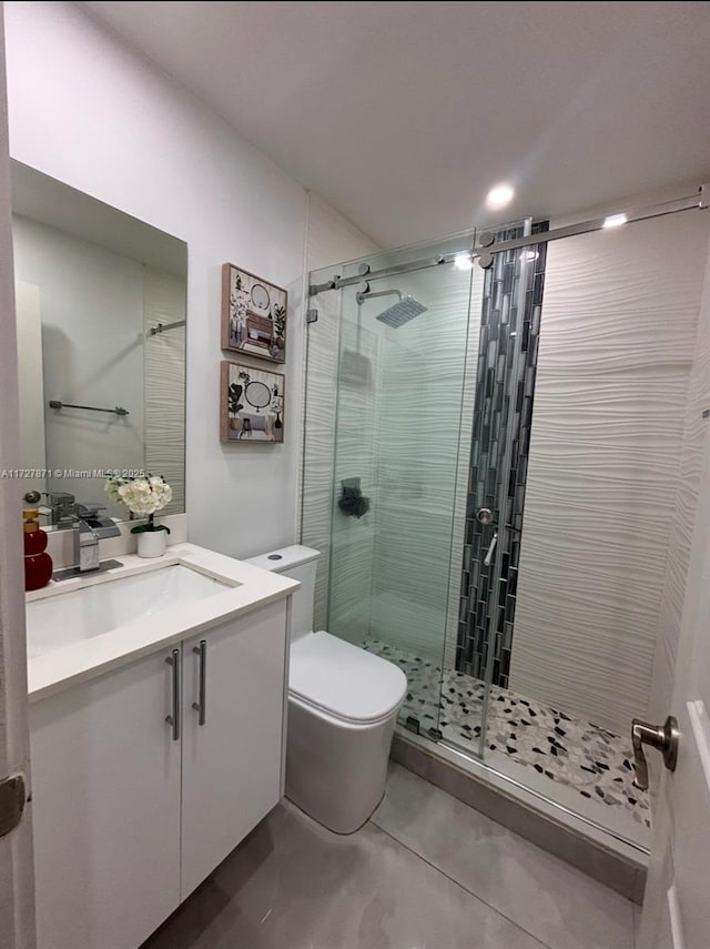 bathroom with vanity, toilet, and walk in shower