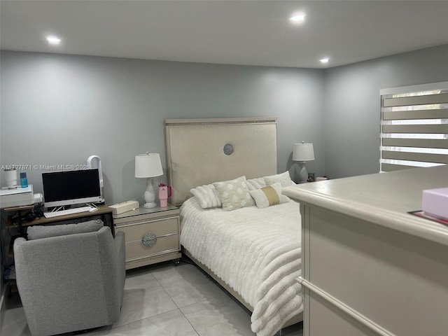 bedroom with light tile patterned floors