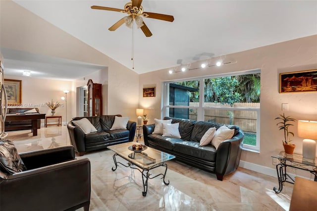 living room featuring ceiling fan and lofted ceiling