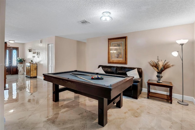 playroom with billiards and a textured ceiling