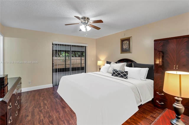 bedroom featuring ceiling fan, dark wood-type flooring, a textured ceiling, and access to exterior