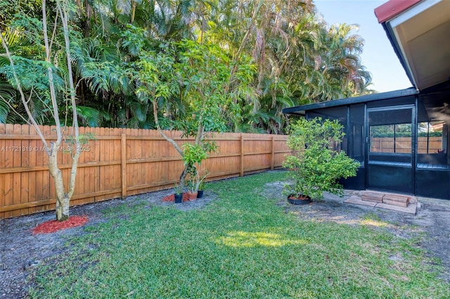 view of yard with a sunroom