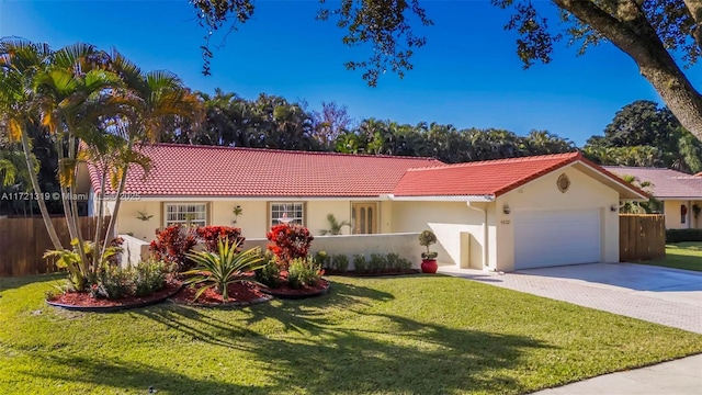 view of front of house featuring a garage and a front yard