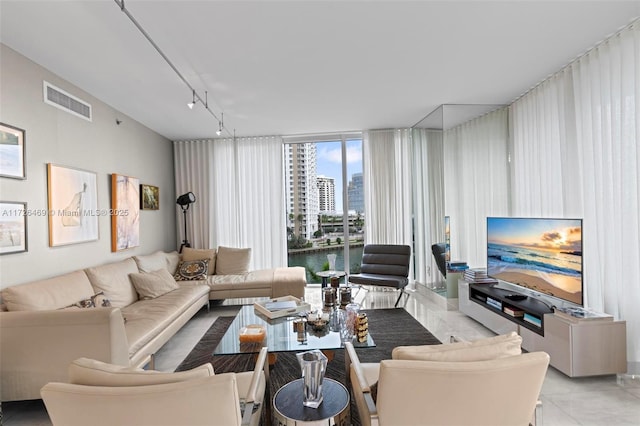 living room with expansive windows and track lighting