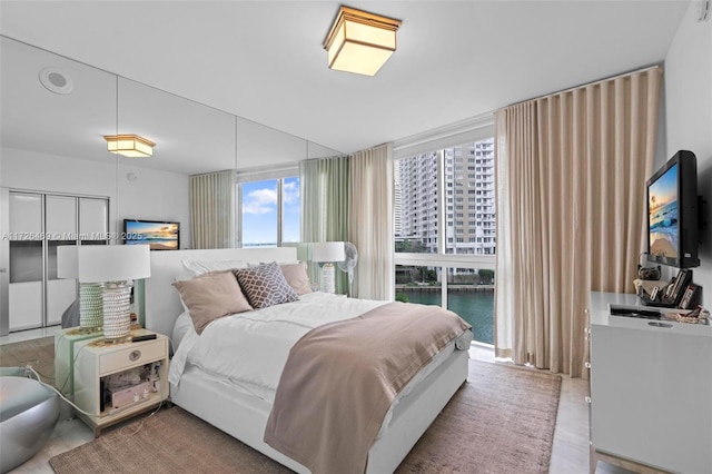 bedroom featuring a wall of windows