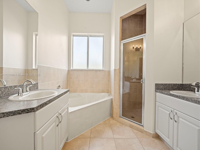 bathroom featuring separate shower and tub, vanity, and tile patterned floors