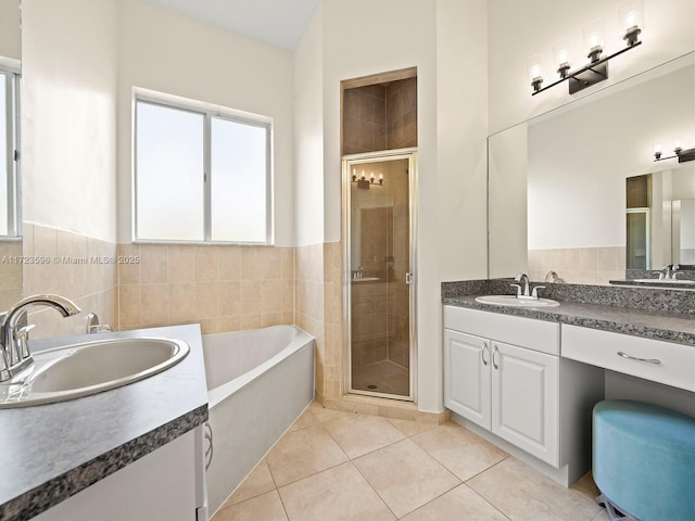 bathroom featuring tile patterned floors, vanity, and independent shower and bath