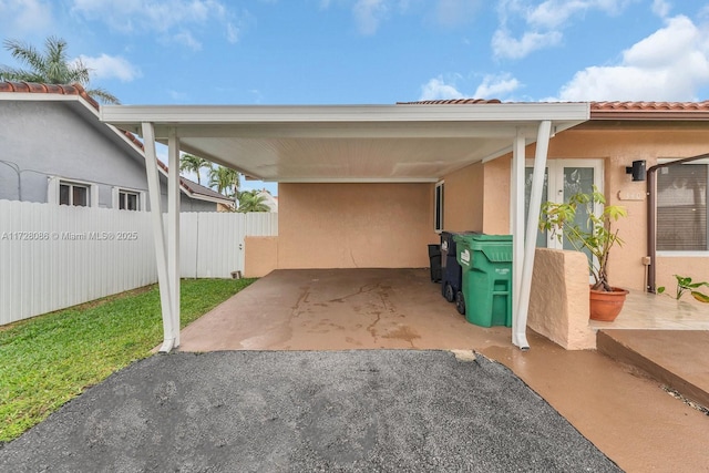 view of parking / parking lot featuring a carport