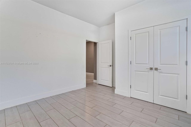 unfurnished bedroom with a closet