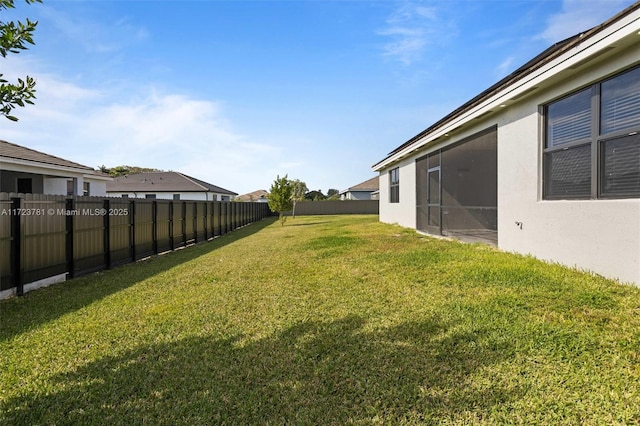 view of yard featuring a sunroom