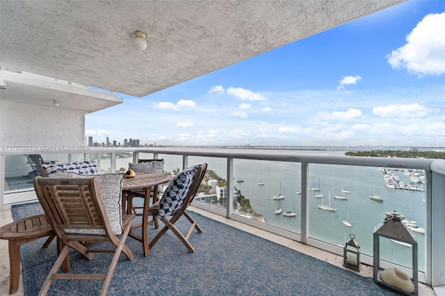 balcony featuring a water view