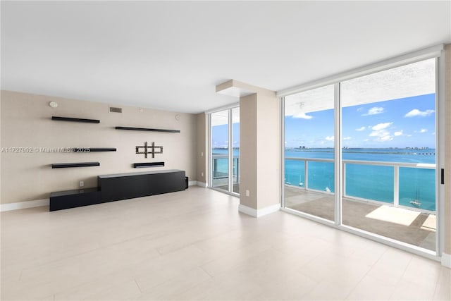 10 Venetian Way Unit 1903, Miami Beach, FL 33139 - unfurnished living room featuring expansive windows and a water view