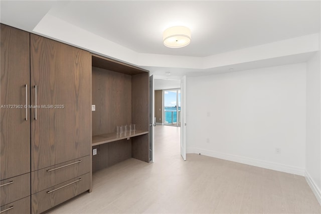 10 Venetian Way Unit 1903, Miami Beach, FL 33139 - unfurnished bedroom featuring baseboards and light wood-type flooring