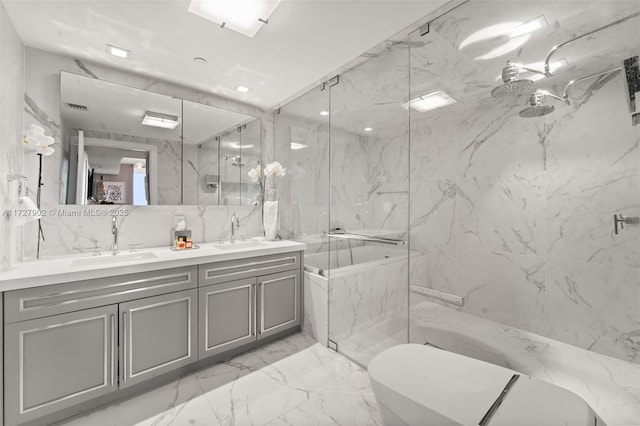 bathroom featuring vanity, a shower with shower door, and toilet