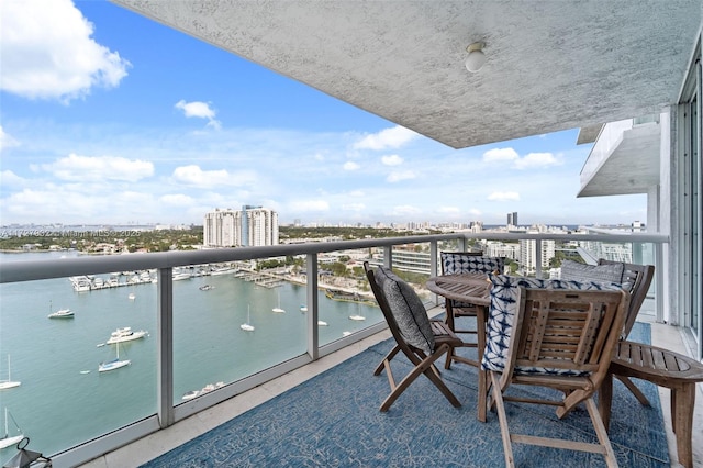 balcony featuring a water view