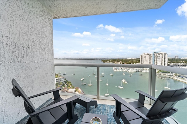 balcony featuring a water view