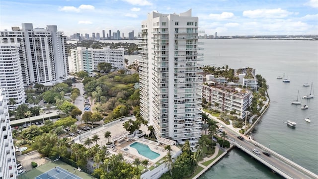 birds eye view of property with a water view