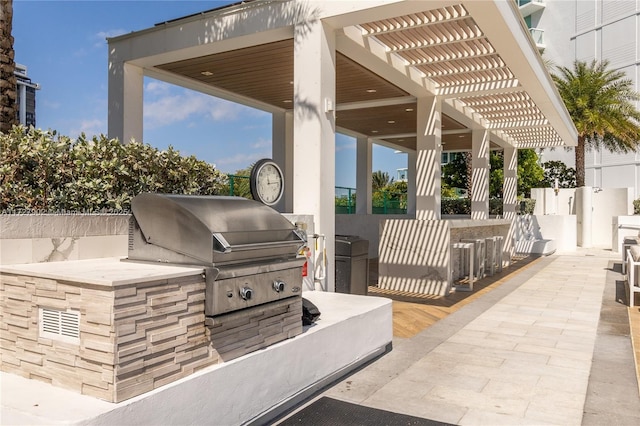 10 Venetian Way Unit 1903, Miami Beach, FL 33139 - view of patio / terrace with exterior kitchen and a pergola