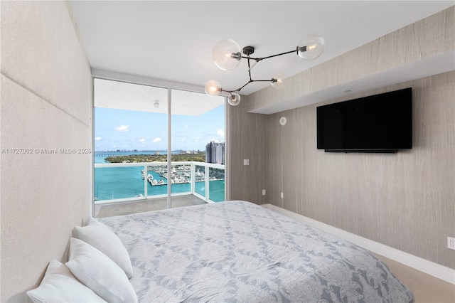 10 Venetian Way Unit 1903, Miami Beach, FL 33139 - bedroom featuring access to outside and floor to ceiling windows