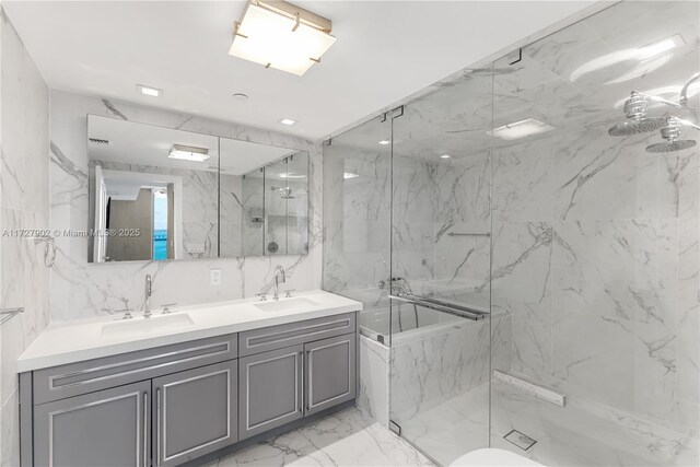 10 Venetian Way Unit 1903, Miami Beach, FL 33139 - full bathroom with a marble finish shower, marble finish floors, double vanity, and a tub with marble appearance