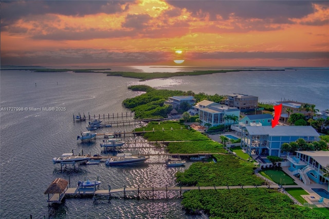 aerial view at dusk with a water view