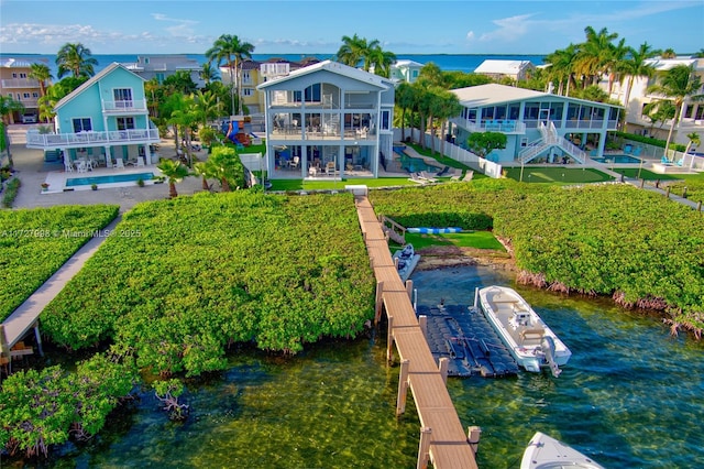 birds eye view of property with a water view