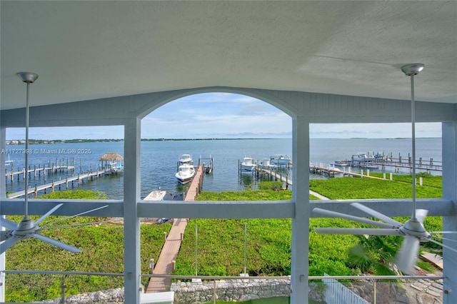 property view of water with a dock