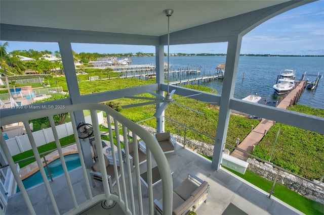 balcony featuring a water view