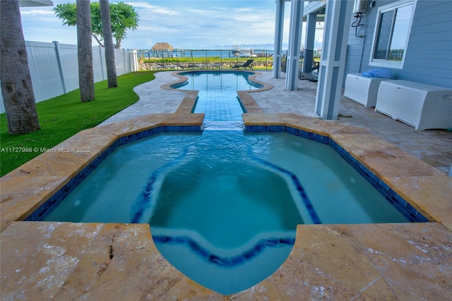 view of pool featuring a patio area and an in ground hot tub