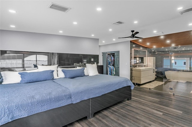 bedroom featuring ceiling fan, a closet, and dark hardwood / wood-style floors