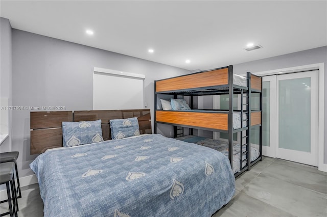 bedroom featuring a closet and concrete flooring