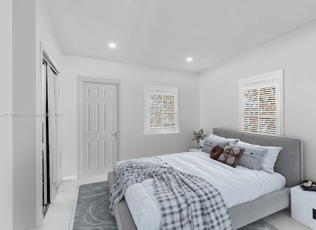 bedroom featuring light tile patterned flooring