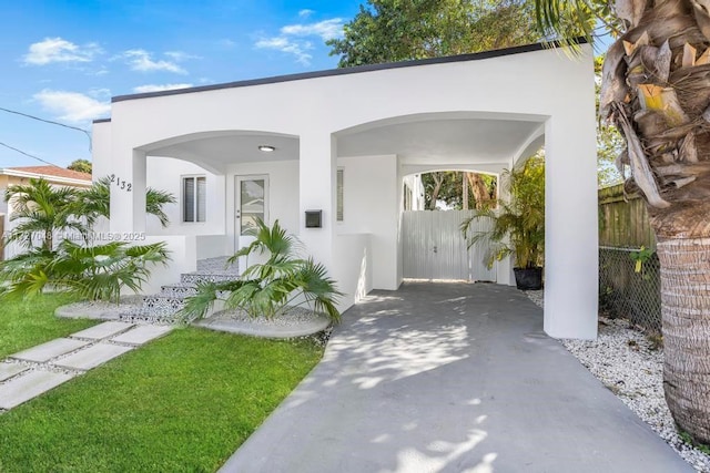 art deco inspired home with a carport